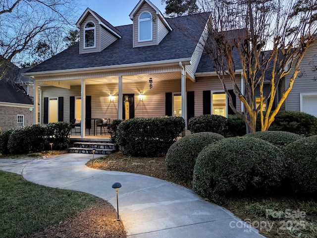 cape cod home with a porch