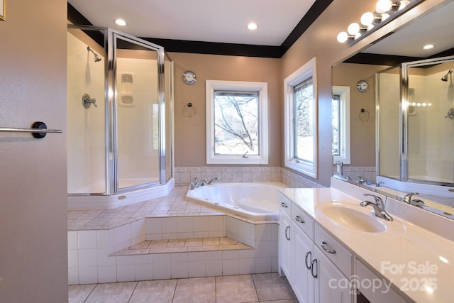 bathroom featuring tile patterned floors, vanity, and separate shower and tub