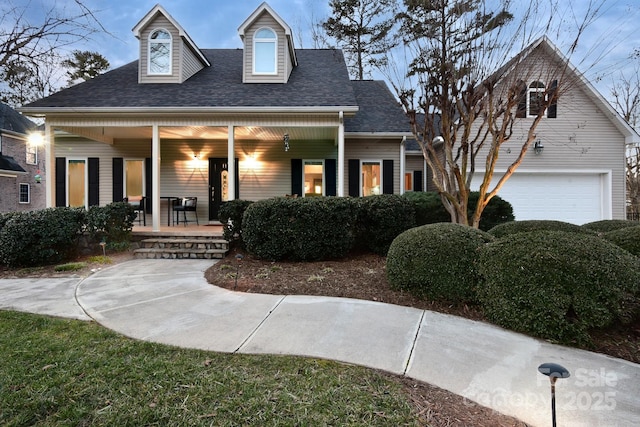 view of front of home with a garage and covered porch