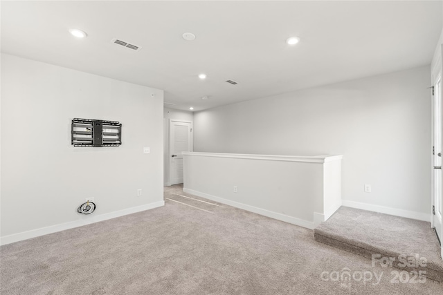 empty room with light colored carpet