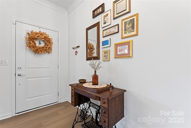 doorway to outside with wood finished floors