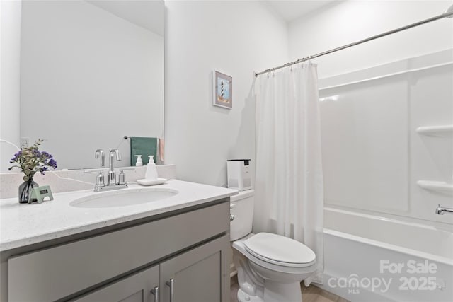 bathroom with shower / bath combination with curtain, vanity, and toilet