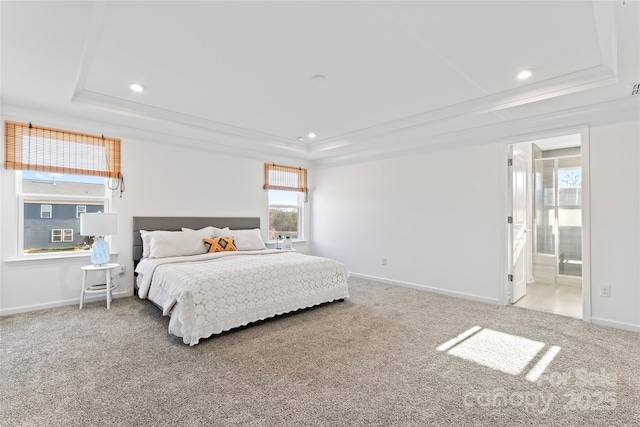 carpeted bedroom with recessed lighting, a raised ceiling, and baseboards