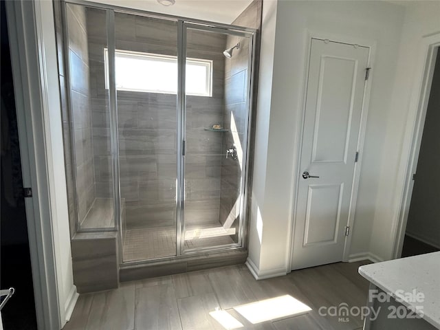 bathroom featuring a shower stall