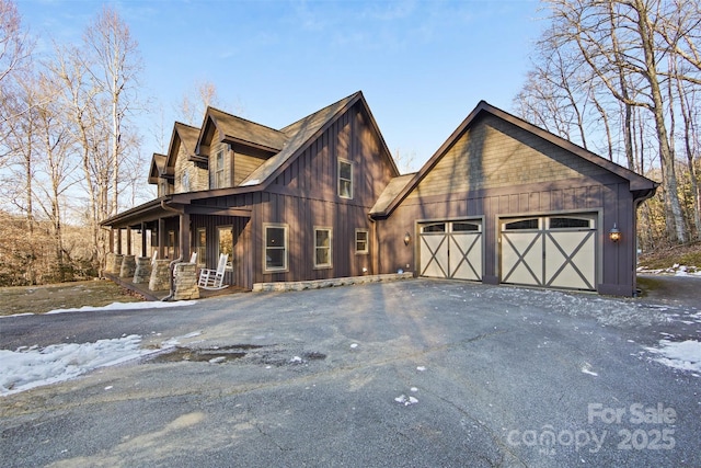 view of front of home featuring a garage and covered porch