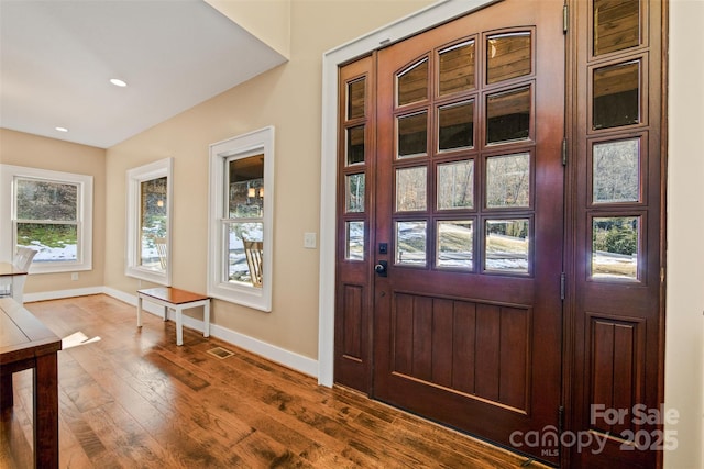 foyer entrance with wood-type flooring