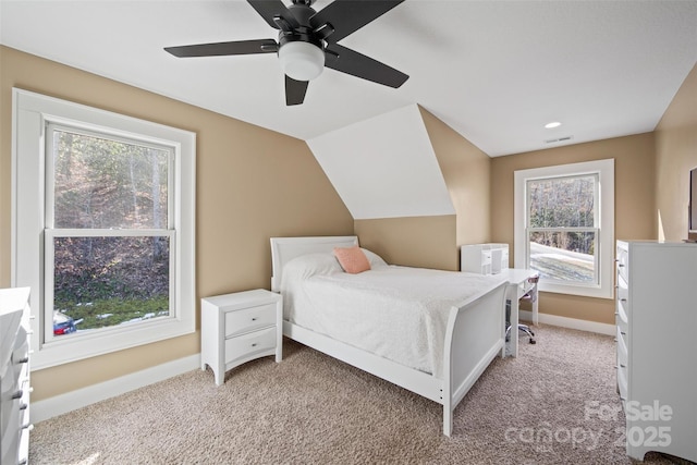 carpeted bedroom featuring vaulted ceiling and ceiling fan