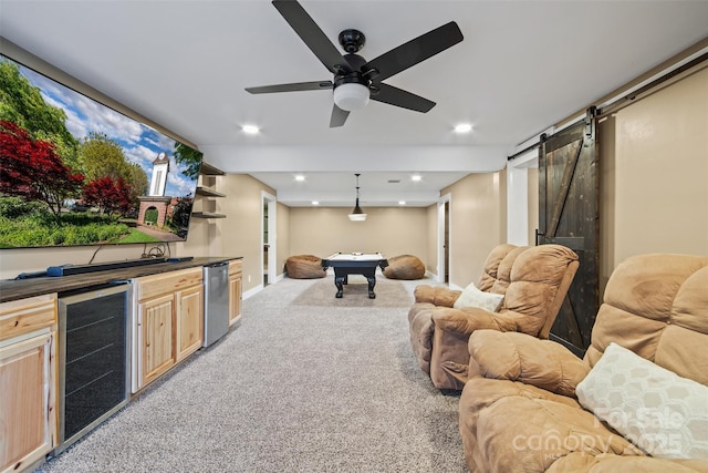 interior space with a barn door, bar, beverage cooler, and billiards