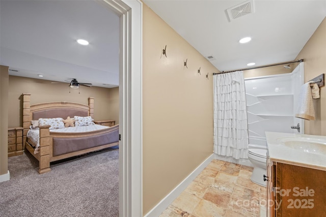 full bathroom with vanity, toilet, ceiling fan, and shower / bath combo with shower curtain