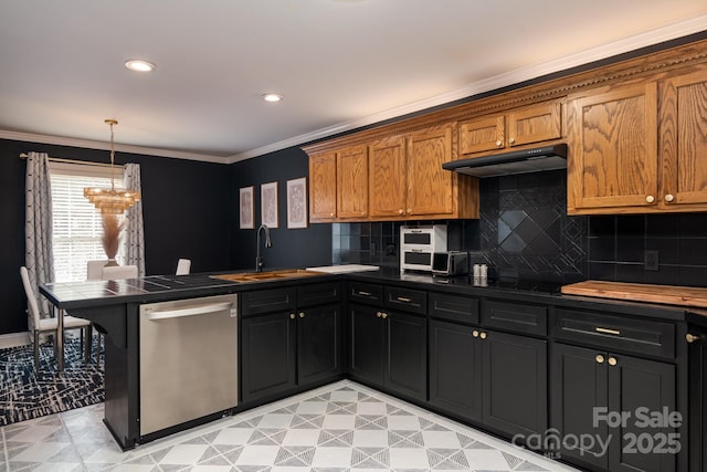 kitchen featuring sink, crown molding, dishwasher, hanging light fixtures, and decorative backsplash