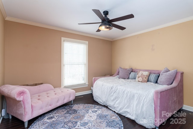 bedroom featuring dark hardwood / wood-style flooring, ornamental molding, and ceiling fan
