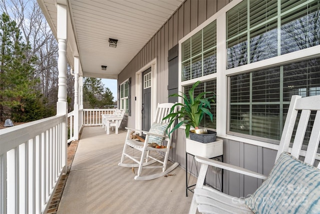 wooden terrace featuring covered porch