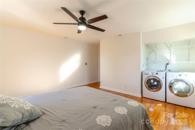 615 Biltmore Ave Unit T7, Asheville, NC 28803 - bedroom with light wood-style flooring, baseboards, a ceiling fan, and independent washer and dryer