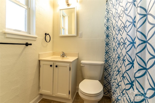 615 Biltmore Ave Unit T7, Asheville, NC 28803 - full bath featuring a textured wall, a shower with shower curtain, toilet, vanity, and tile patterned floors