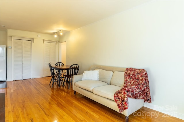 615 Biltmore Ave Unit T7, Asheville, NC 28803 - living room featuring baseboards, wood finished floors, and crown molding