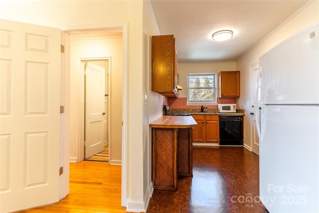 615 Biltmore Ave Unit T7, Asheville, NC 28803 - kitchen with brown cabinets, a sink, wood finished floors, white appliances, and baseboards