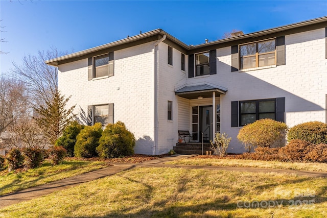 615 Biltmore Ave Unit T7, Asheville, NC 28803 - exterior space featuring brick siding and a lawn