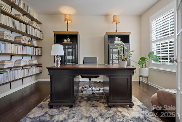 home office with dark wood-type flooring