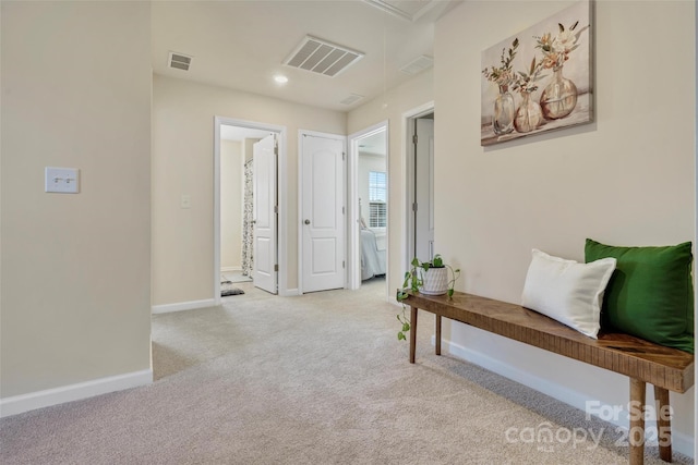 hallway featuring light carpet