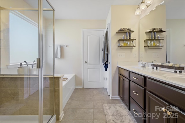 bathroom featuring plus walk in shower, tile patterned flooring, and vanity