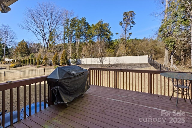 wooden deck featuring grilling area