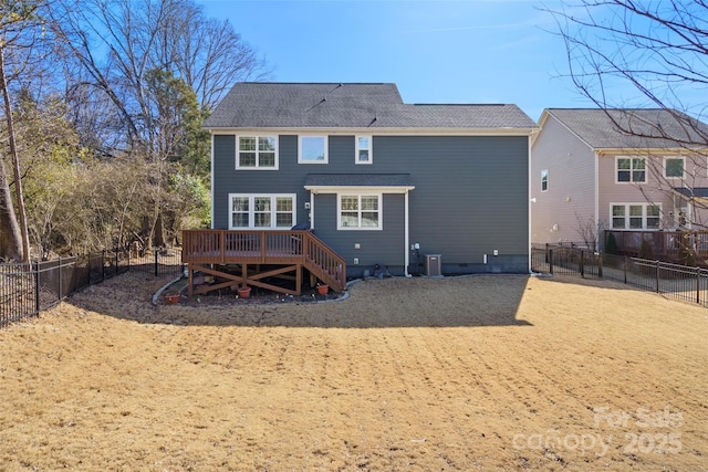 back of property featuring a wooden deck