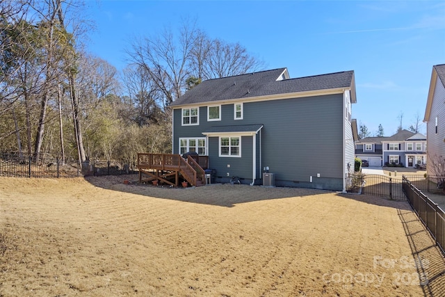 rear view of house featuring a deck