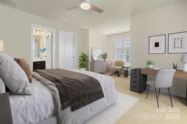 carpeted bedroom featuring ceiling fan and ensuite bath