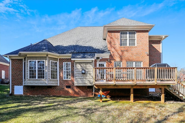 rear view of property featuring a deck and a lawn