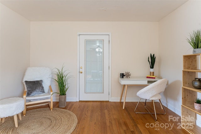 living area with wood-type flooring