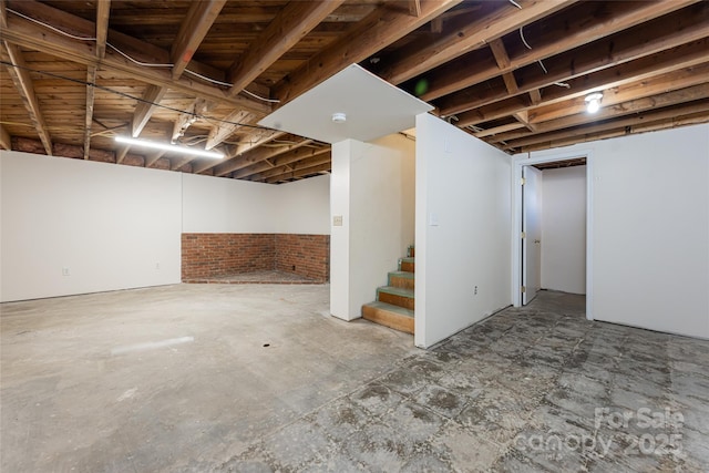 basement with brick wall