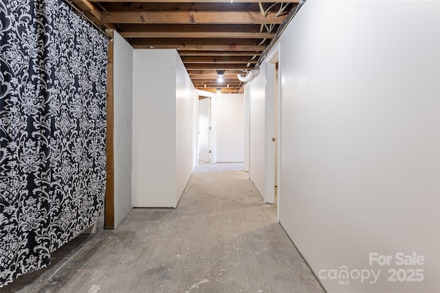 hallway featuring concrete flooring