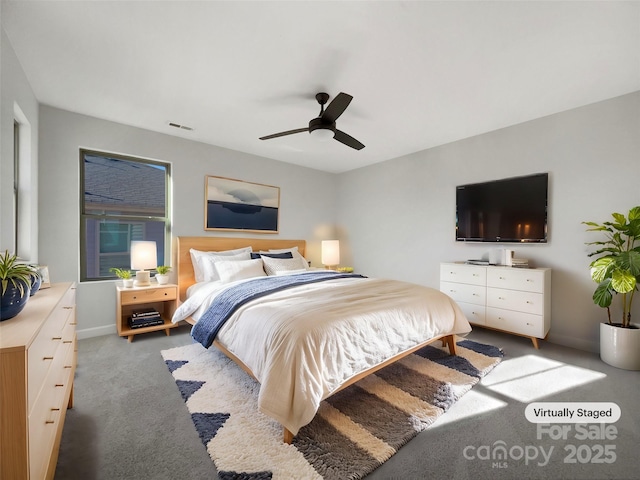 bedroom with ceiling fan and carpet flooring