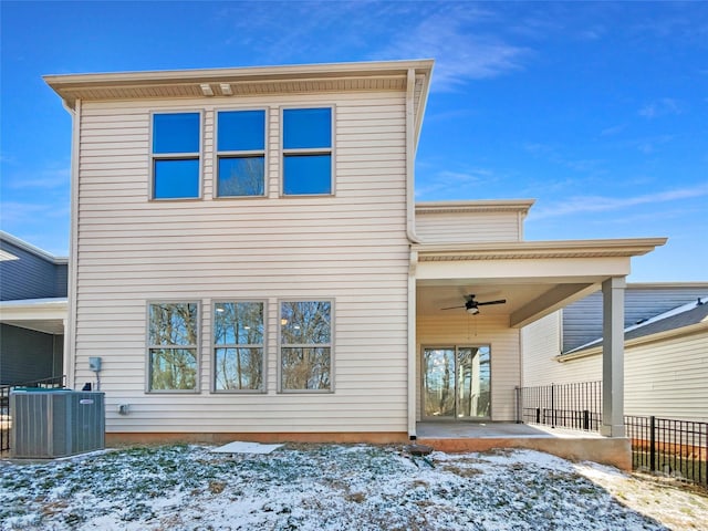 snow covered property with central AC unit, a patio, and ceiling fan