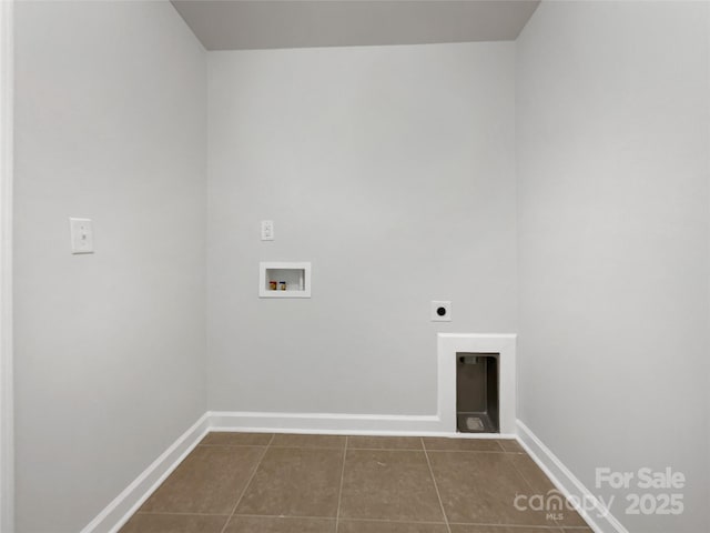 clothes washing area featuring electric dryer hookup, hookup for a washing machine, and dark tile patterned floors