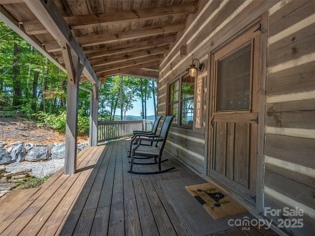 wooden terrace featuring a porch