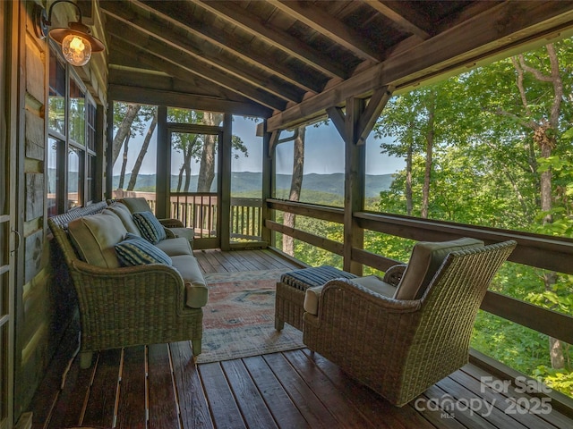 wooden deck with a mountain view