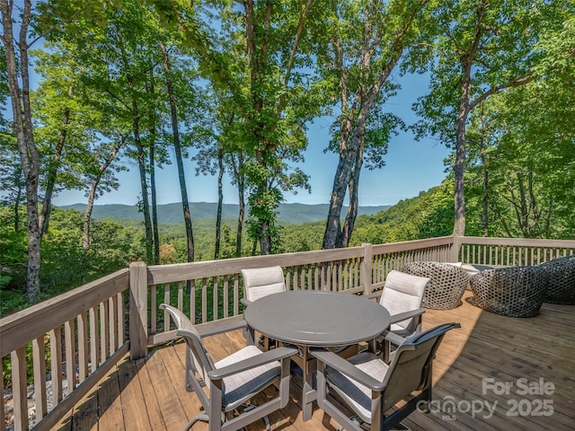 wooden deck with a mountain view