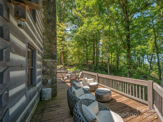 wooden terrace with outdoor lounge area