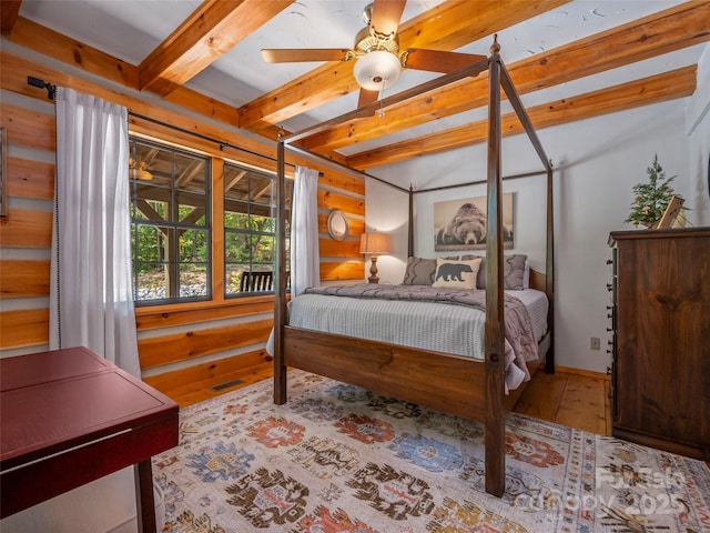 bedroom with beam ceiling and ceiling fan