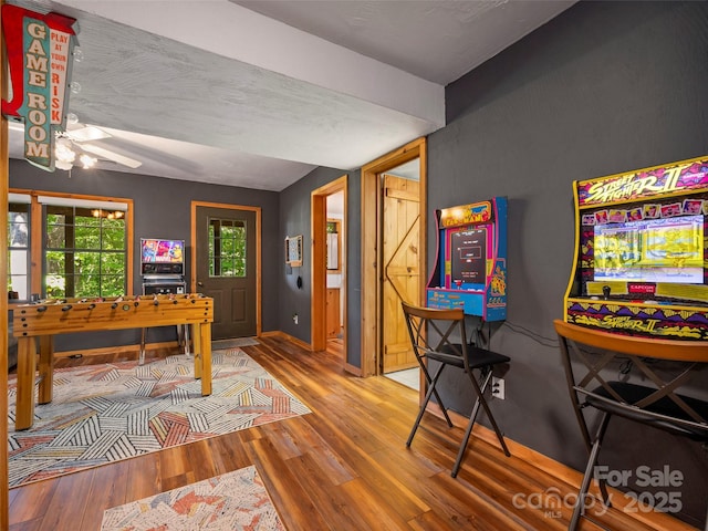 game room with hardwood / wood-style floors and ceiling fan