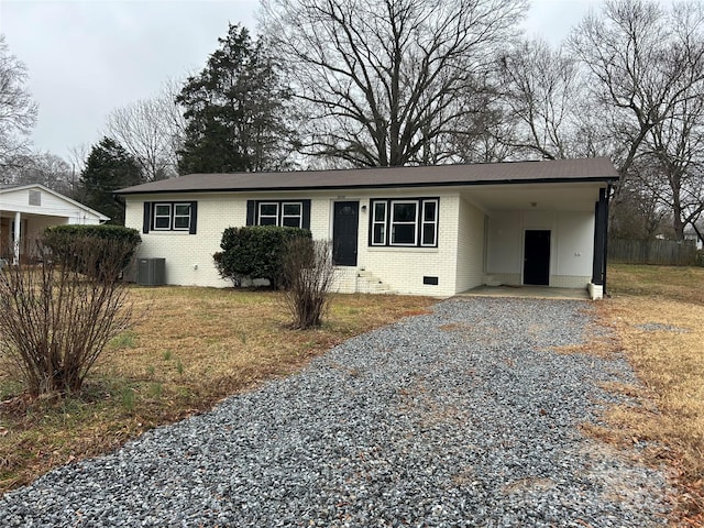 single story home with a carport and central air condition unit