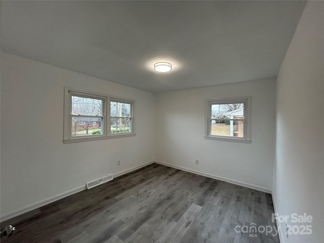 empty room with wood-type flooring