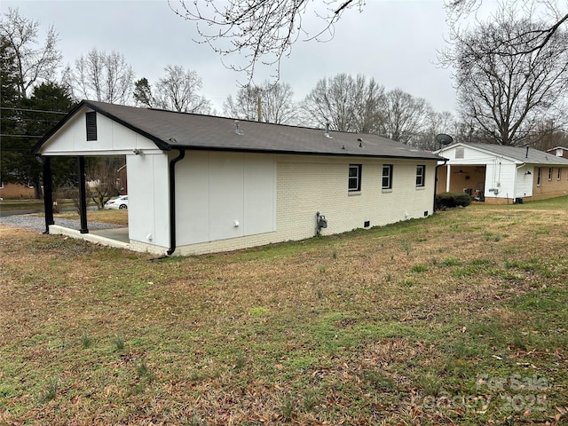 view of home's exterior with a yard