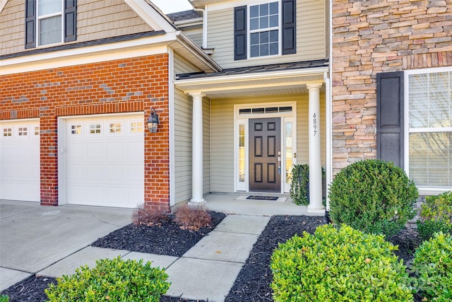 view of exterior entry featuring a garage