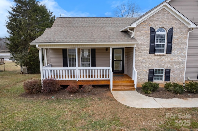 view of front of property featuring a porch and a front lawn