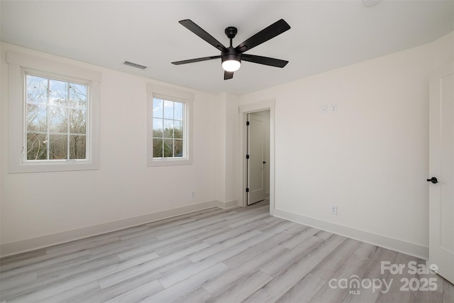 177 Olympia Dr, Mooresville, NC 28117 - spare room with visible vents, ceiling fan, light wood-style flooring, and baseboards