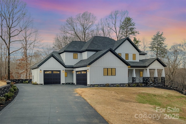 modern farmhouse featuring a garage