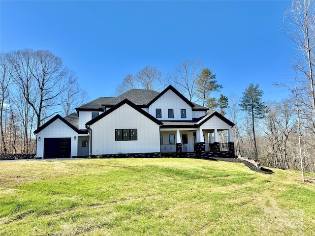 modern farmhouse featuring a porch, a garage, a shingled roof, board and batten siding, and a front yard