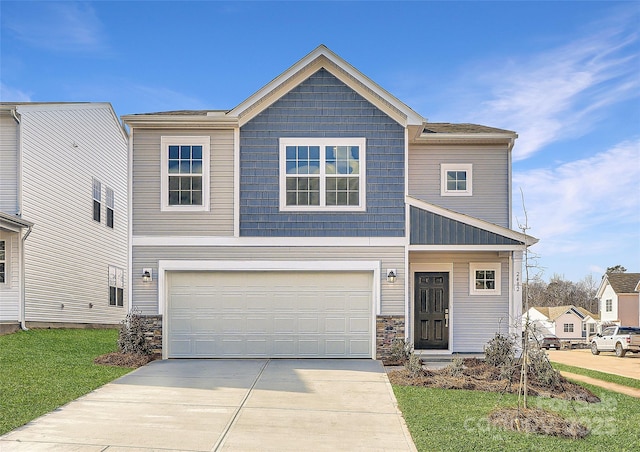 craftsman-style house featuring a garage and a front yard